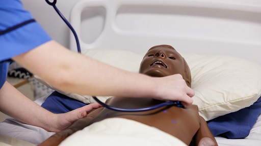 A student working with a manikin