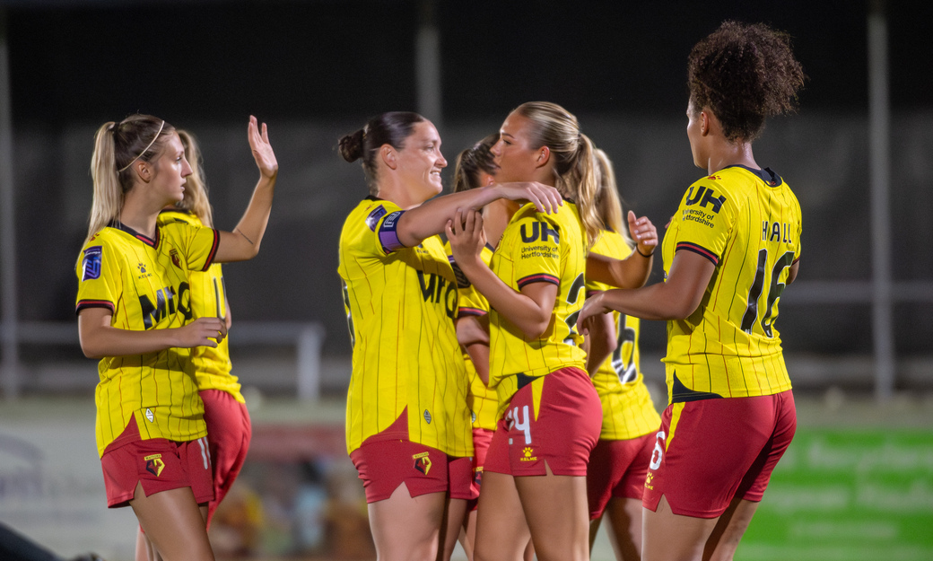 Female players in a huddle