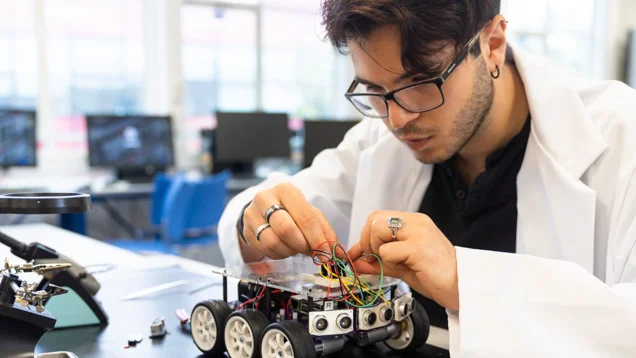 Male student working on a project