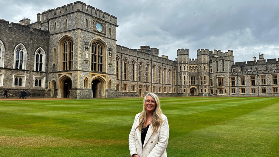 Jo Stuart standing in front of Windsor Castle