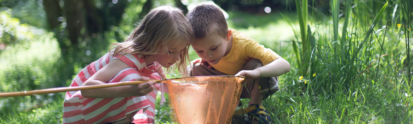 two kids looking in a net