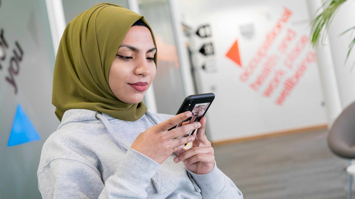 Female student looking at mobile phone