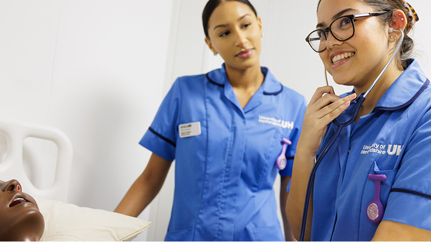 Two students in scrubs 